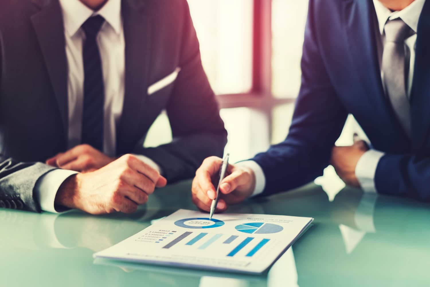 Business consultants reviewing strategy and analytics reports